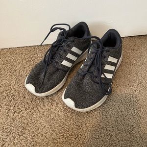 purple and white Adidas athletic shoes